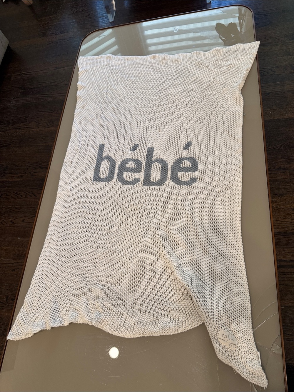 bebe cream knit throw with gray logo